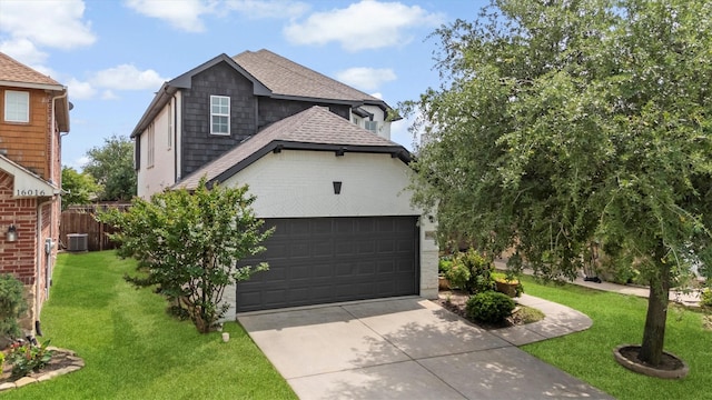 16012 Alvarado Dr, Prosper, TX 75078 - view of front of home with concrete driveway, a front yard, roof with shingles, a garage, and central AC unit
