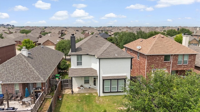 16012 Alvarado Dr, Prosper, TX 75078 - back of house featuring a residential view, a chimney, a patio, and a shingled roof