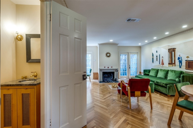 4306 Buena Vista St Unit 106F, Dallas, TX 75205 - living area with recessed lighting, a fireplace, and ornamental molding