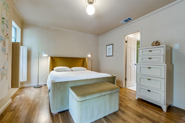 4306 Buena Vista St Unit 106F, Dallas, TX 75205 - bedroom with light wood-type flooring, ornamental molding, and baseboards