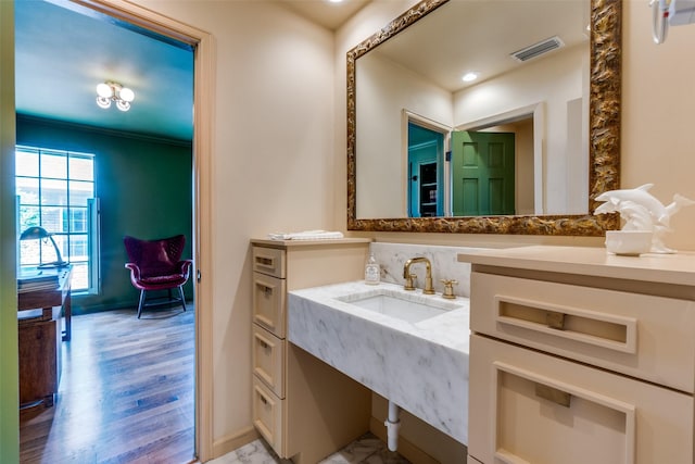 4306 Buena Vista St Unit 106F, Dallas, TX 75205 - bathroom with vanity, baseboards, and wood finished floors