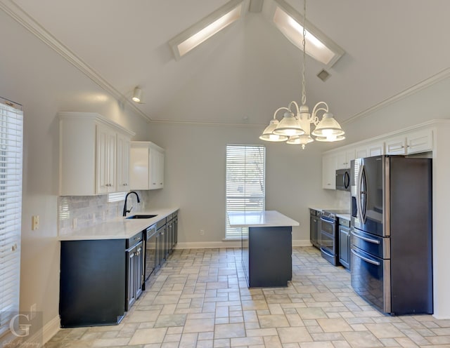 510 Weavers Way, Bossier City, LA 71111 - kitchen featuring appliances with stainless steel finishes, a sink, a kitchen island, a chandelier, and light countertops