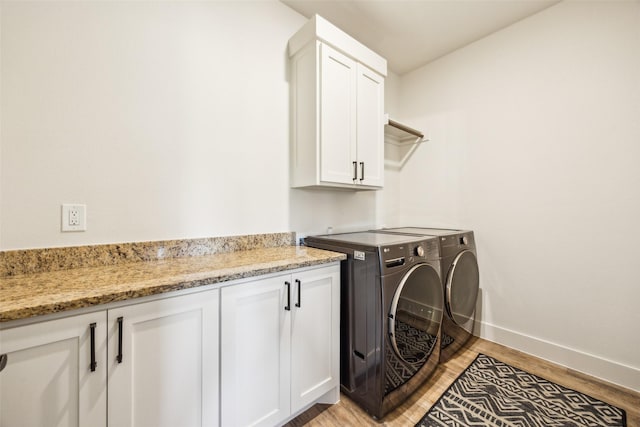1308 Green Ridge Rd, Weatherford, TX 76085 - washroom with separate washer and dryer, cabinet space, light wood finished floors, and baseboards