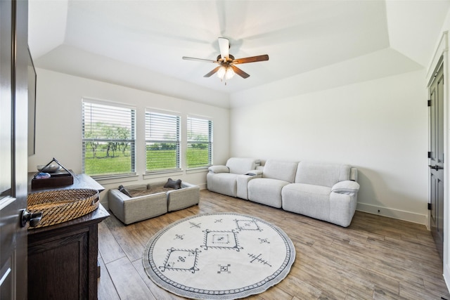 1308 Green Ridge Rd, Weatherford, TX 76085 - living room with a ceiling fan, a raised ceiling, wood finished floors, and baseboards