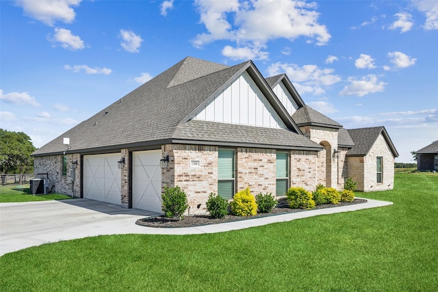 1308 Green Ridge Rd, Weatherford, TX 76085 - view of front of property featuring board and batten siding, concrete driveway, brick siding, a front lawn, and a shingled roof