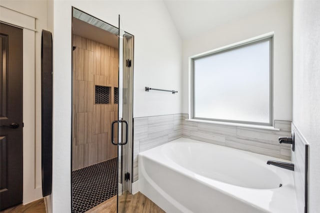 1308 Green Ridge Rd, Weatherford, TX 76085 - full bath featuring a bath, a shower stall, wood finished floors, and lofted ceiling