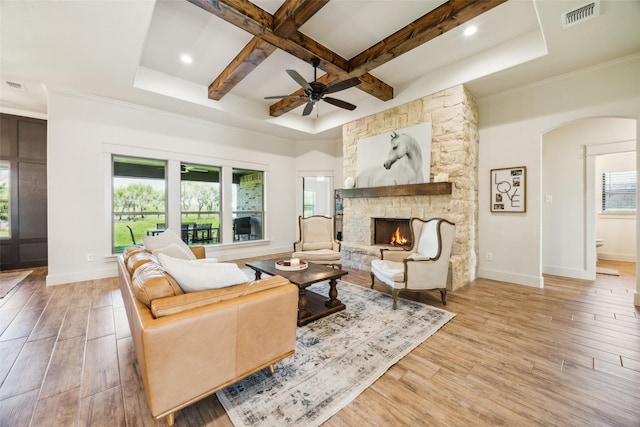 1308 Green Ridge Rd, Weatherford, TX 76085 - living area featuring a stone fireplace, coffered ceiling, light wood finished floors, baseboards, and a ceiling fan