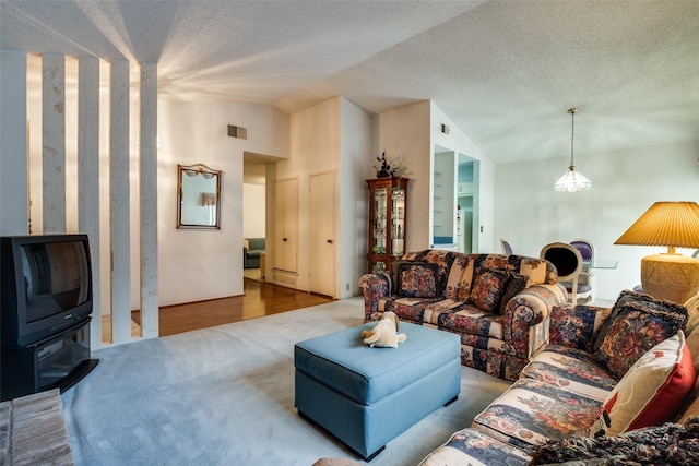 1916 Cobblestone Ln, Garland, TX 75042 - living room featuring lofted ceiling, carpet, and a textured ceiling