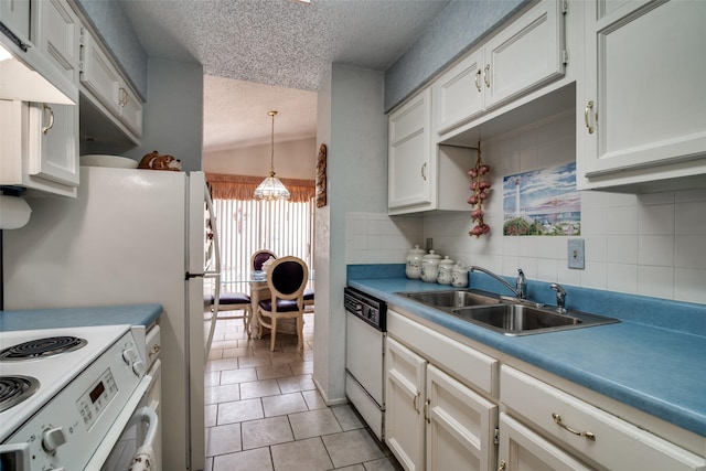 1916 Cobblestone Ln, Garland, TX 75042 - kitchen with white dishwasher, a textured ceiling, a sink, a chandelier, and vaulted ceiling