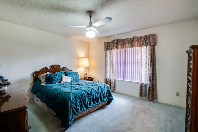 1916 Cobblestone Ln, Garland, TX 75042 - carpeted bedroom with a textured ceiling and a ceiling fan