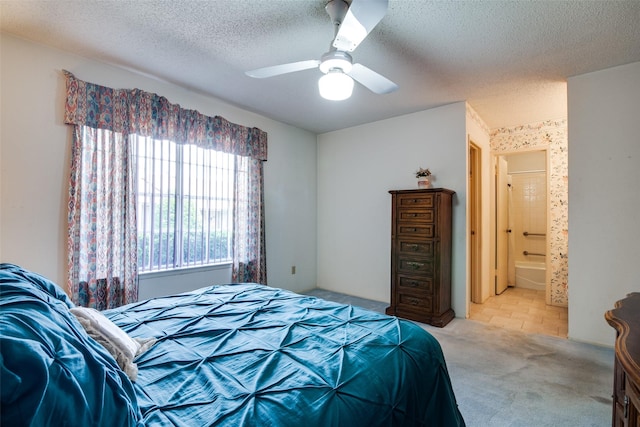1916 Cobblestone Ln, Garland, TX 75042 - bedroom featuring carpet flooring, a textured ceiling, a ceiling fan, and connected bathroom