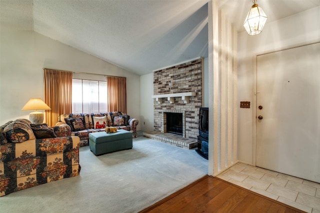 1916 Cobblestone Ln, Garland, TX 75042 - living area with vaulted ceiling, wood finished floors, a brick fireplace, and a textured ceiling