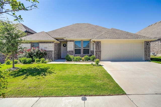 15125 Belclaire Ave, Aledo, TX 76008 - view of front facade featuring an attached garage, a front lawn, brick siding, driveway, and roof with shingles