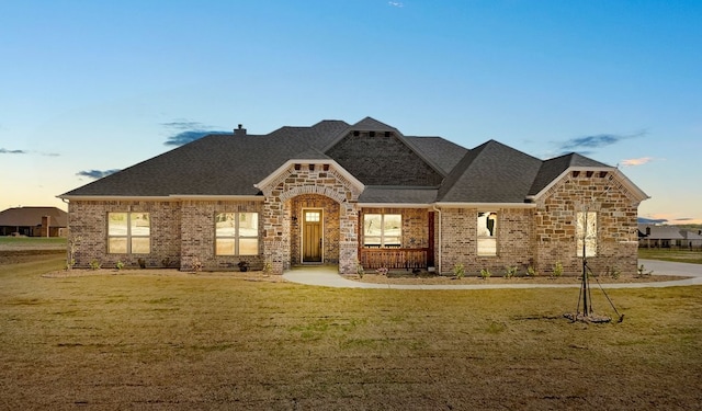 411 Solo Ridge Dr, Waxahachie, TX 75167 - french country home with a lawn, brick siding, and a shingled roof