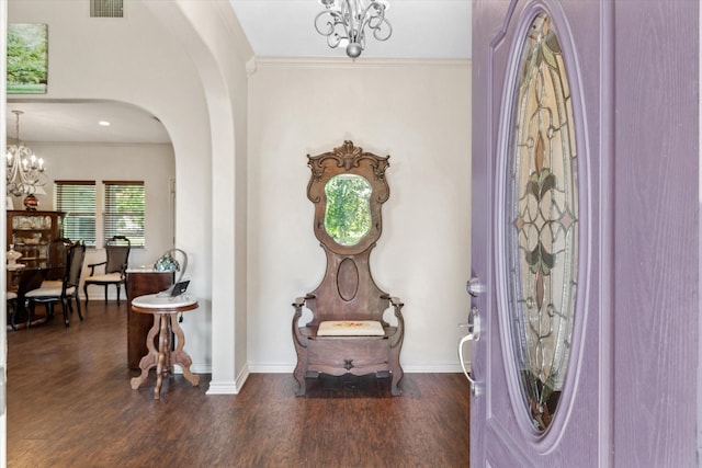 10040 Fm 17, Grand Saline, TX 75140 - entrance foyer featuring a chandelier, wood finished floors, arched walkways, baseboards, and ornamental molding