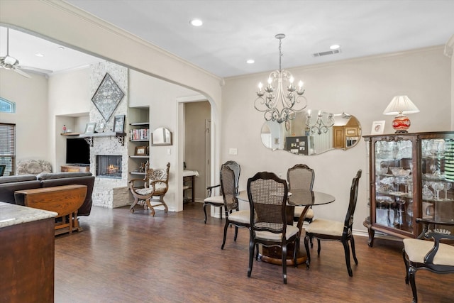 10040 Fm 17, Grand Saline, TX 75140 - dining room featuring arched walkways, a ceiling fan, dark wood-style flooring, baseboards, and ornamental molding