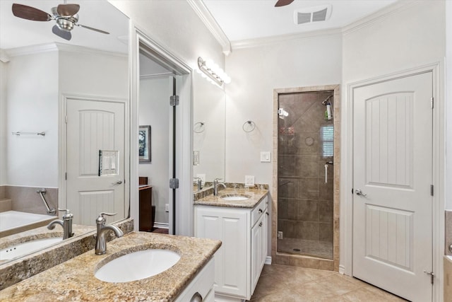 10040 Fm 17, Grand Saline, TX 75140 - bathroom featuring a ceiling fan, a stall shower, two vanities, ornamental molding, and a garden tub