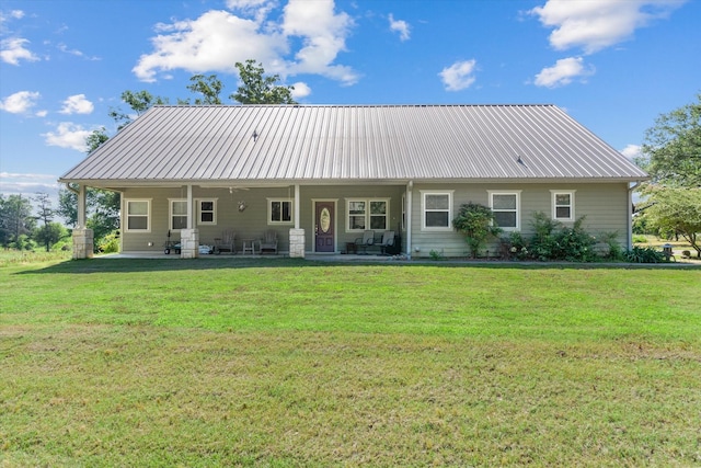 10040 Fm 17, Grand Saline, TX 75140 - rear view of property featuring a lawn and metal roof