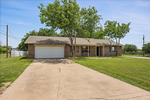 1023 Holmes Dr, Granbury, TX 76048 - view of front facade featuring driveway, an attached garage, and brick siding