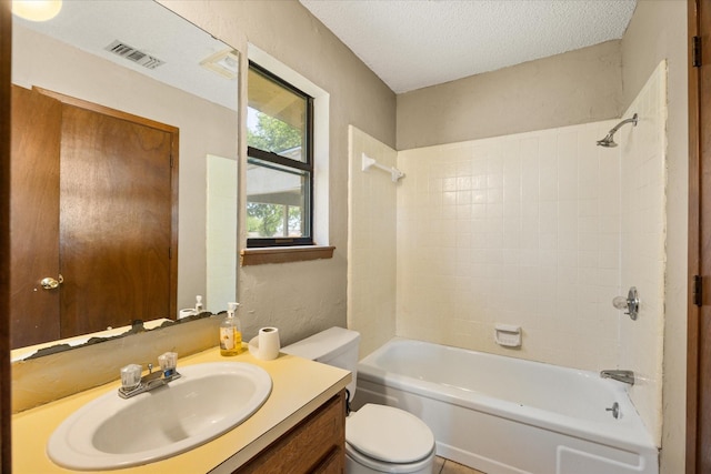 1023 Holmes Dr, Granbury, TX 76048 - full bathroom with vanity, toilet,  shower combination, a textured wall, and a textured ceiling