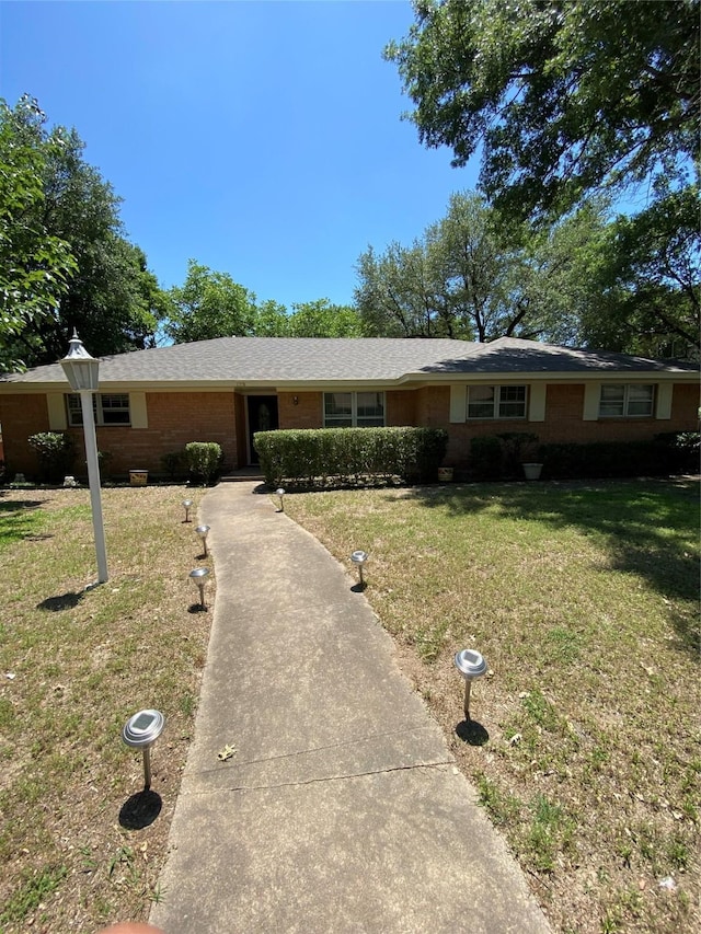 1203 Springbrook Cir, Desoto, TX 75115 - ranch-style home with a front lawn and brick siding