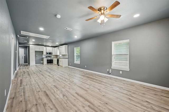 906 S Willow St, Sherman, TX 75090 - unfurnished living room featuring attic access, light wood-style flooring, ceiling fan, and recessed lighting