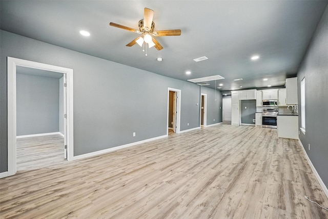 906 S Willow St, Sherman, TX 75090 - unfurnished living room with attic access, light wood-style floors, ceiling fan, and recessed lighting