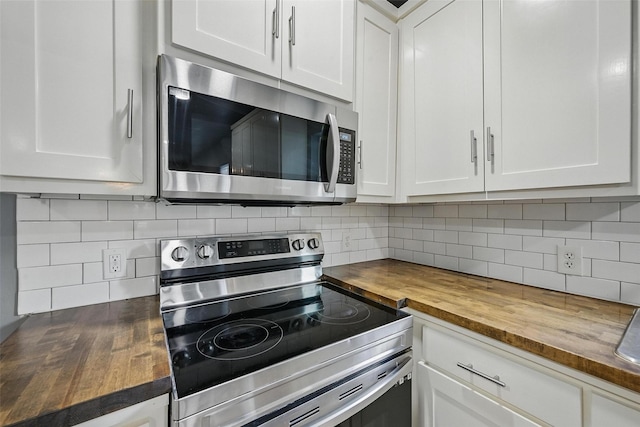 906 S Willow St, Sherman, TX 75090 - kitchen with wood counters, stainless steel appliances, decorative backsplash, and white cabinets