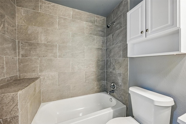 906 S Willow St, Sherman, TX 75090 - bathroom featuring toilet and shower / washtub combination