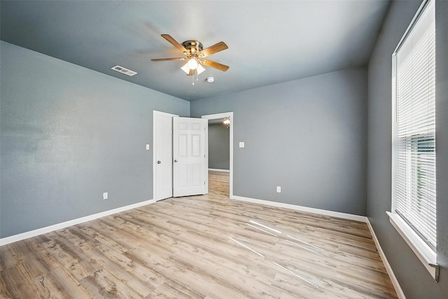 906 S Willow St, Sherman, TX 75090 - unfurnished bedroom with light wood finished floors and ceiling fan