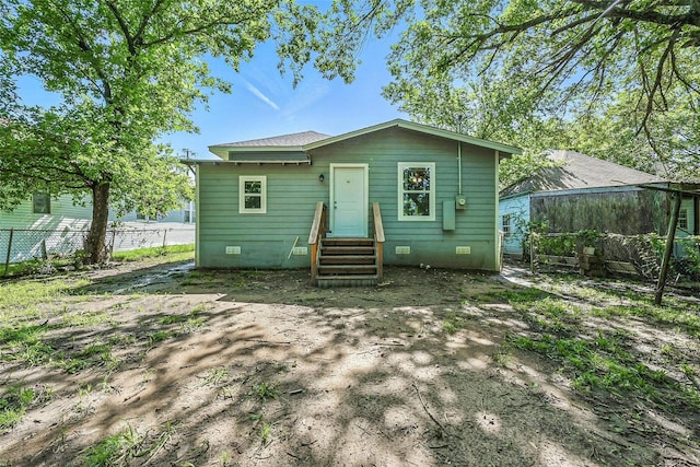 906 S Willow St, Sherman, TX 75090 - rear view of property featuring crawl space and entry steps