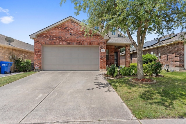 1213 Alder Tree Ln, Royse City, TX 75189 - view of front of home with brick siding, a front yard, an attached garage, and concrete driveway