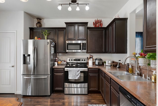 1213 Alder Tree Ln, Royse City, TX 75189 - kitchen with appliances with stainless steel finishes, a sink, dark brown cabinetry, and dark wood finished floors
