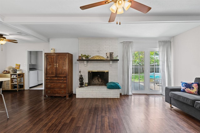 103 Auburn St, Waxahachie, TX 75165 - living area featuring a ceiling fan, wood finished floors, beam ceiling, a fireplace, and washing machine and dryer