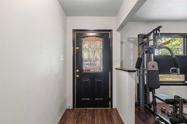 103 Auburn St, Waxahachie, TX 75165 - foyer entrance with wood finished floors and baseboards