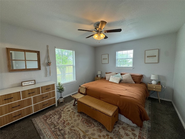 706 Jefferson Ave, Cisco, TX 76437 - bedroom featuring baseboards, a ceiling fan, and carpet flooring
