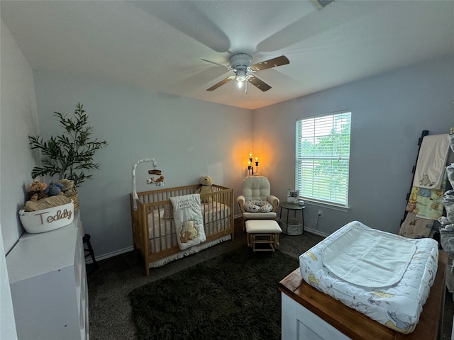 706 Jefferson Ave, Cisco, TX 76437 - carpeted bedroom with ceiling fan and baseboards