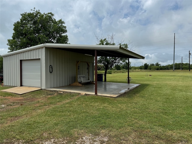706 Jefferson Ave, Cisco, TX 76437 - view of green lawn featuring an outbuilding and a garage