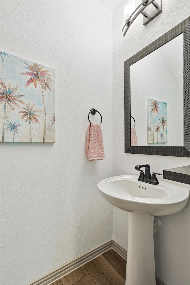 6015 Liverpool St, Celina, TX 76227 - bathroom with wood finished floors, baseboards, and a sink