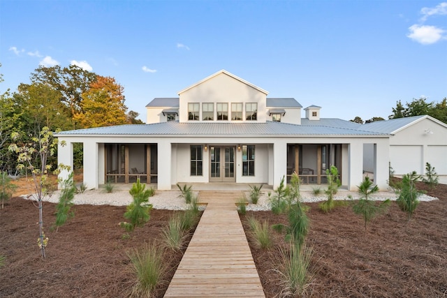 23538 Kate Ln, Arp, TX 75750 - back of property featuring stucco siding, a sunroom, french doors, and metal roof