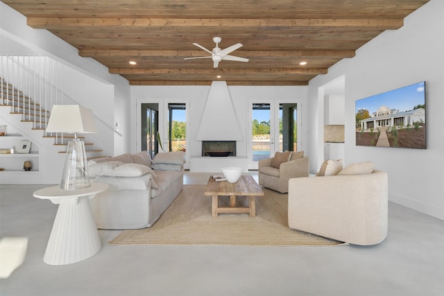 23538 Kate Ln, Arp, TX 75750 - living area with stairway, a fireplace, wooden ceiling with exposed beams, ceiling fan, and french doors