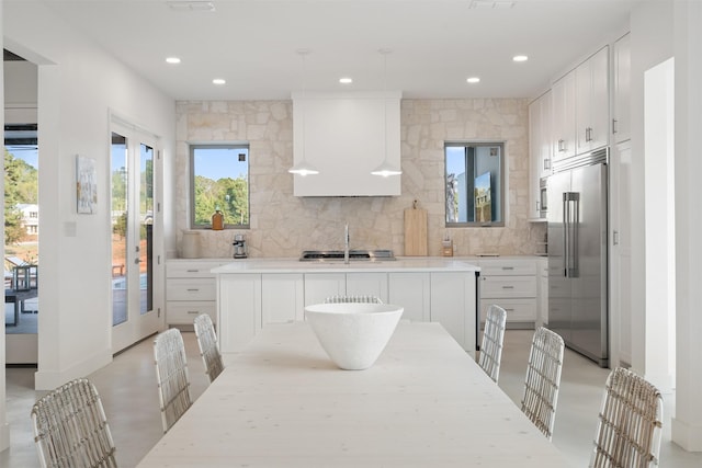 23538 Kate Ln, Arp, TX 75750 - kitchen with stainless steel built in fridge, custom range hood, backsplash, recessed lighting, and white cabinets