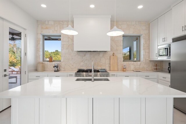 23538 Kate Ln, Arp, TX 75750 - kitchen featuring stainless steel appliances, tasteful backsplash, recessed lighting, a sink, and a kitchen island with sink