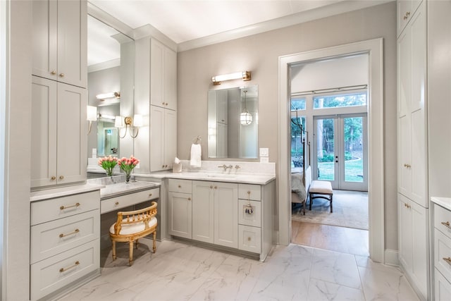 5620 Copper Park, Tyler, TX 75703 - bathroom featuring french doors, marble look tiles, vanity, and ensuite bathroom
