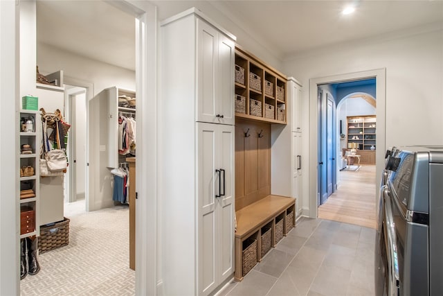5620 Copper Park, Tyler, TX 75703 - mudroom featuring washing machine and clothes dryer and baseboards