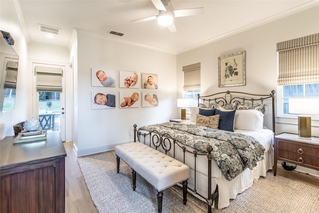 5620 Copper Park, Tyler, TX 75703 - bedroom featuring multiple windows, light wood-style floors, crown molding, a ceiling fan, and baseboards