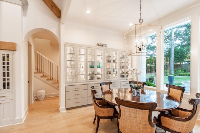5620 Copper Park, Tyler, TX 75703 - dining room featuring a chandelier, light wood finished floors, stairs, arched walkways, and recessed lighting