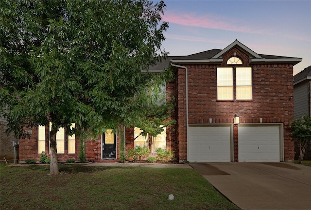 8620 Thistle Ridge Ter, Fort Worth, TX 76123 - view of front facade with a garage, driveway, brick siding, and a yard