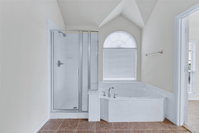 8620 Thistle Ridge Ter, Fort Worth, TX 76123 - bathroom featuring a shower stall, a bath, healthy amount of natural light, tile patterned flooring, and vaulted ceiling