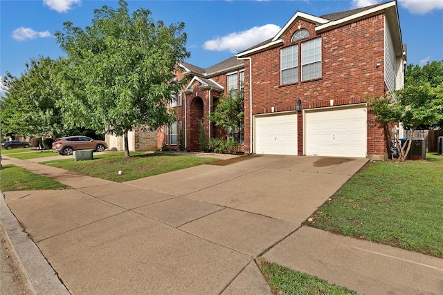 8620 Thistle Ridge Ter, Fort Worth, TX 76123 - view of front of home featuring brick siding, an attached garage, driveway, and a front lawn